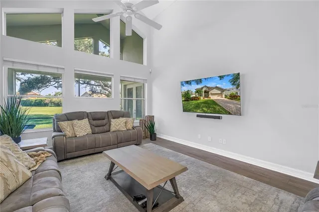 a view of a house with pool and sitting area