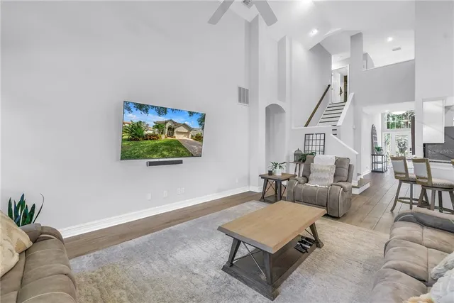 a view of a house with yard and tree s