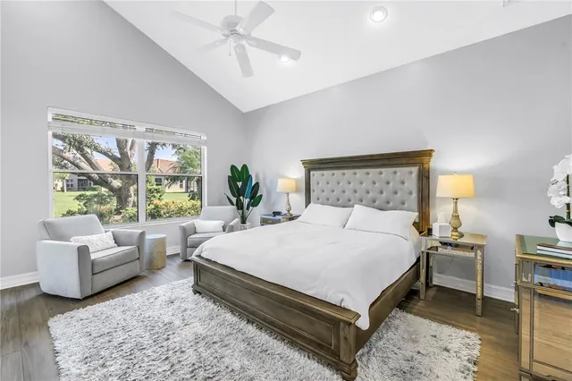 a bedroom with a large bed and a couch