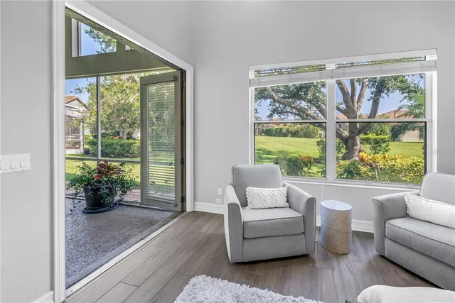 a living room with furniture and a large window