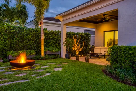 a view of a swimming pool with a garden and plants