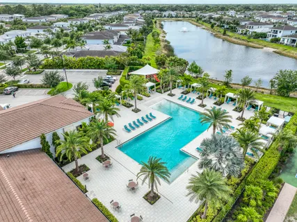 an aerial view of a house with a lake view
