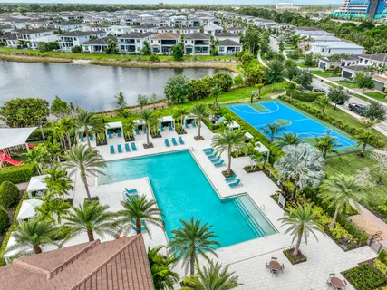 an aerial view of a pool yard and outdoor seating