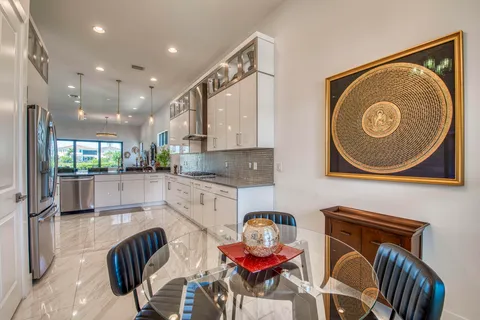 a kitchen with stainless steel appliances granite countertop a sink and cabinets