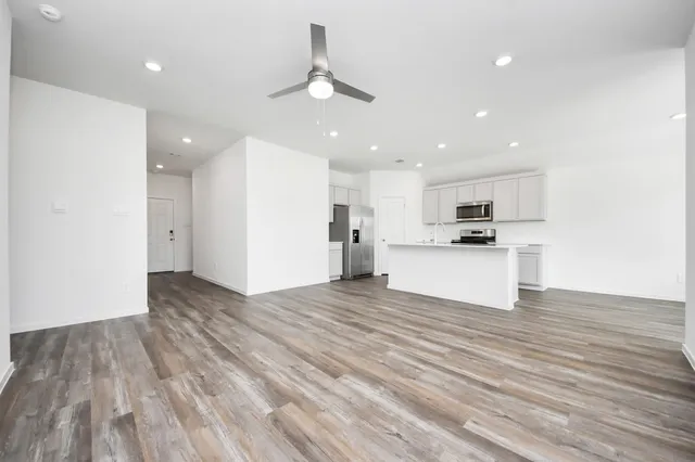 a view of kitchen view wooden floor and window