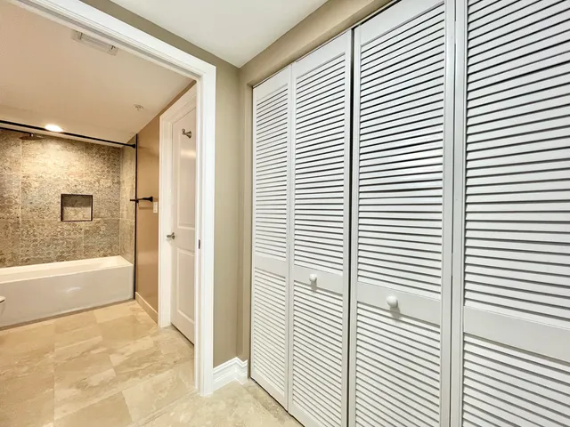 a bathroom with a bathtub and a shower