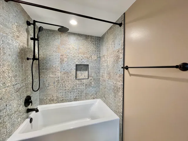 a bathroom with a shower and a shower