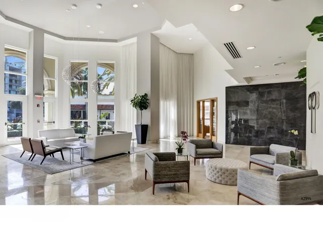 a living room with furniture and a painting