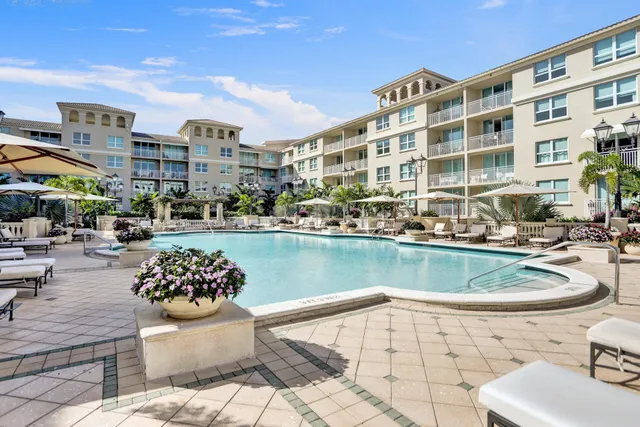 a view of swimming pool with outdoor seating and plants
