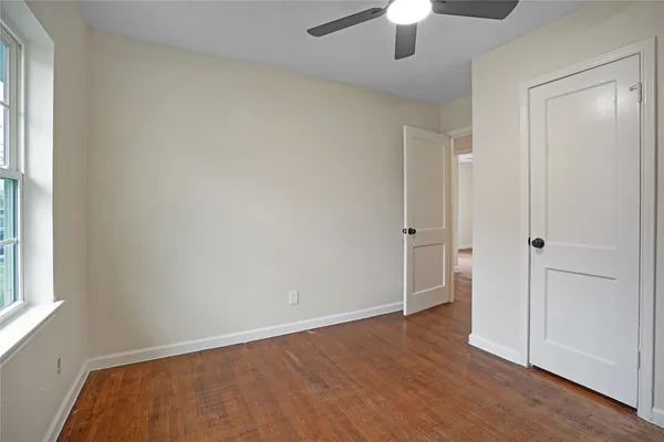 an empty room with a empty space and a window