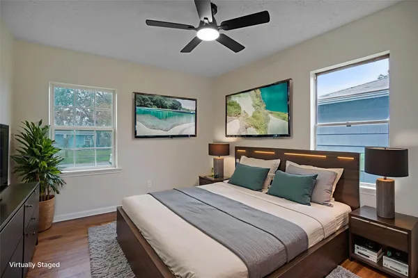 a bedroom with bed and a window
