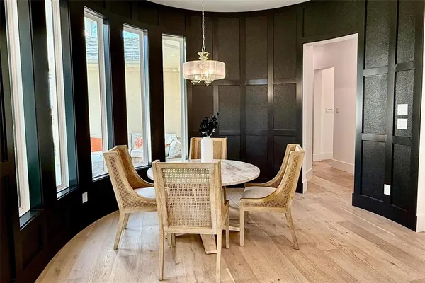 a view of a dining room with furniture and window