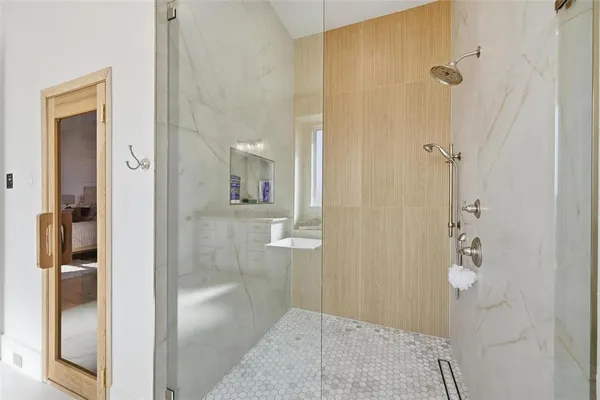 wooden bathroom with a glass shower door