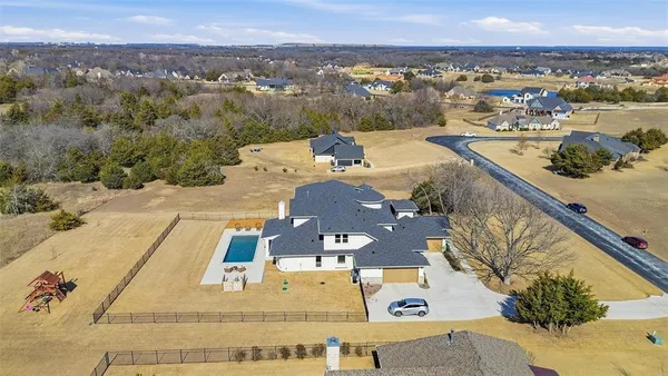 an aerial view of a house with a outdoor space