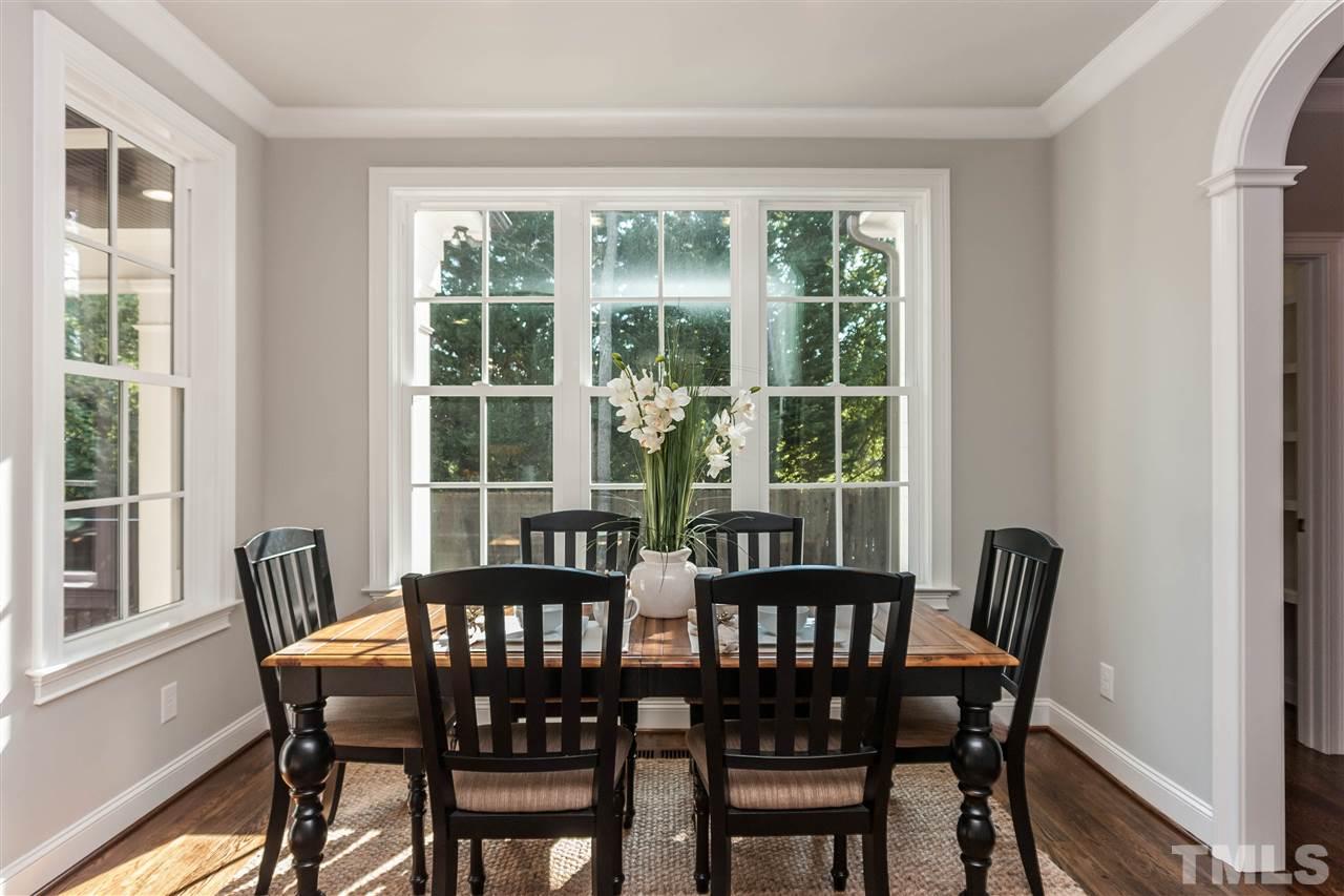 3106 Ashel Street Raleigh, NC 27612 - Photo 13 of 25 a view of a dining room with furniture window and outside view