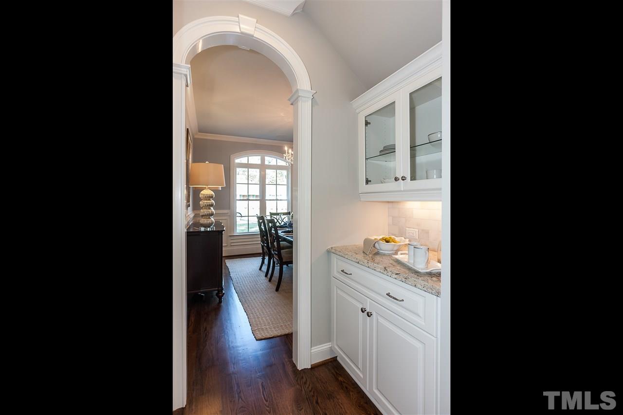 3106 Ashel Street Raleigh, NC 27612 - Photo 14 of 25 a view of a hallway view with wooden floor and living room