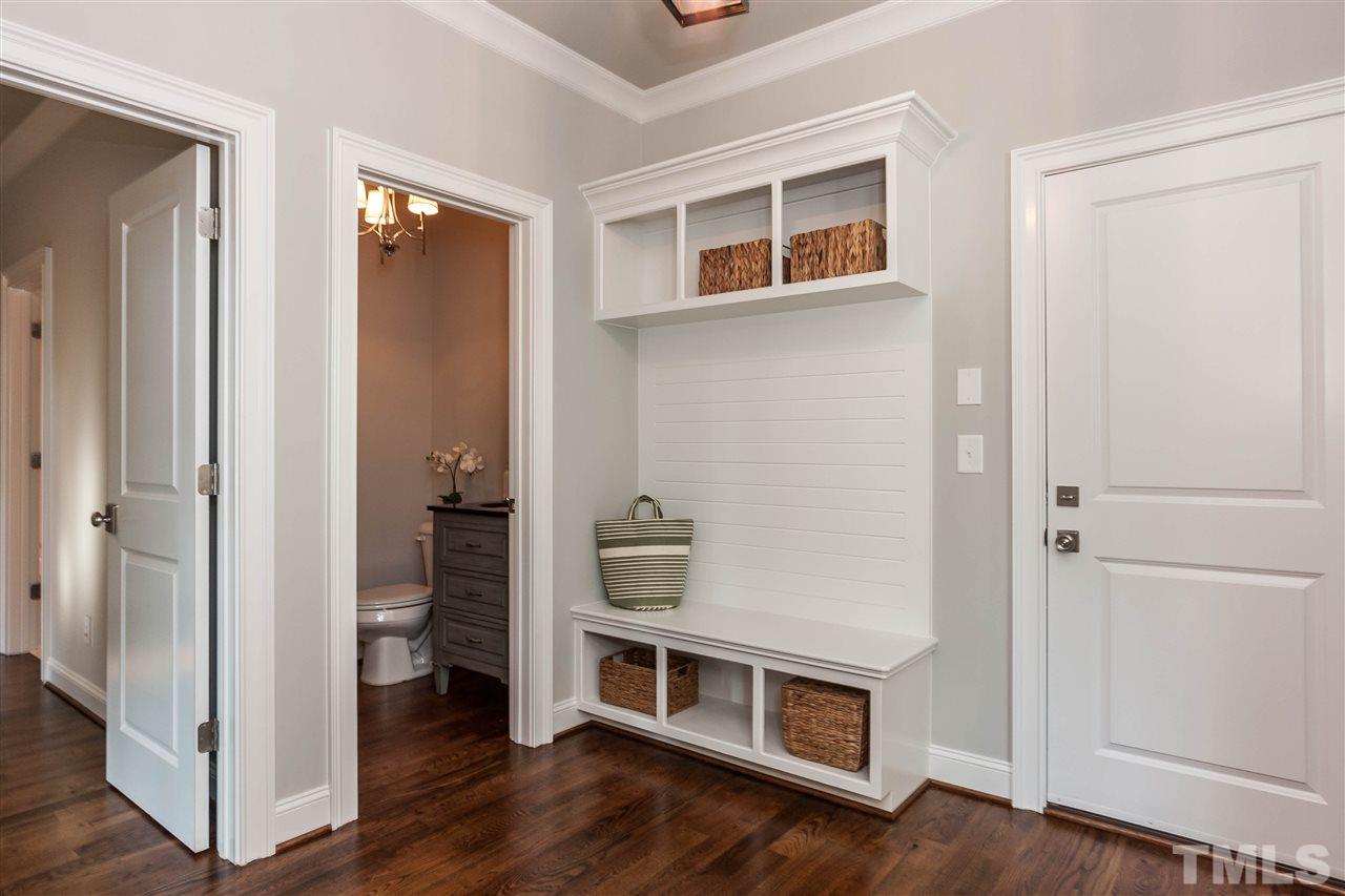 3106 Ashel Street Raleigh, NC 27612 - Photo 15 of 25 a room that has a bed and a wooden floor