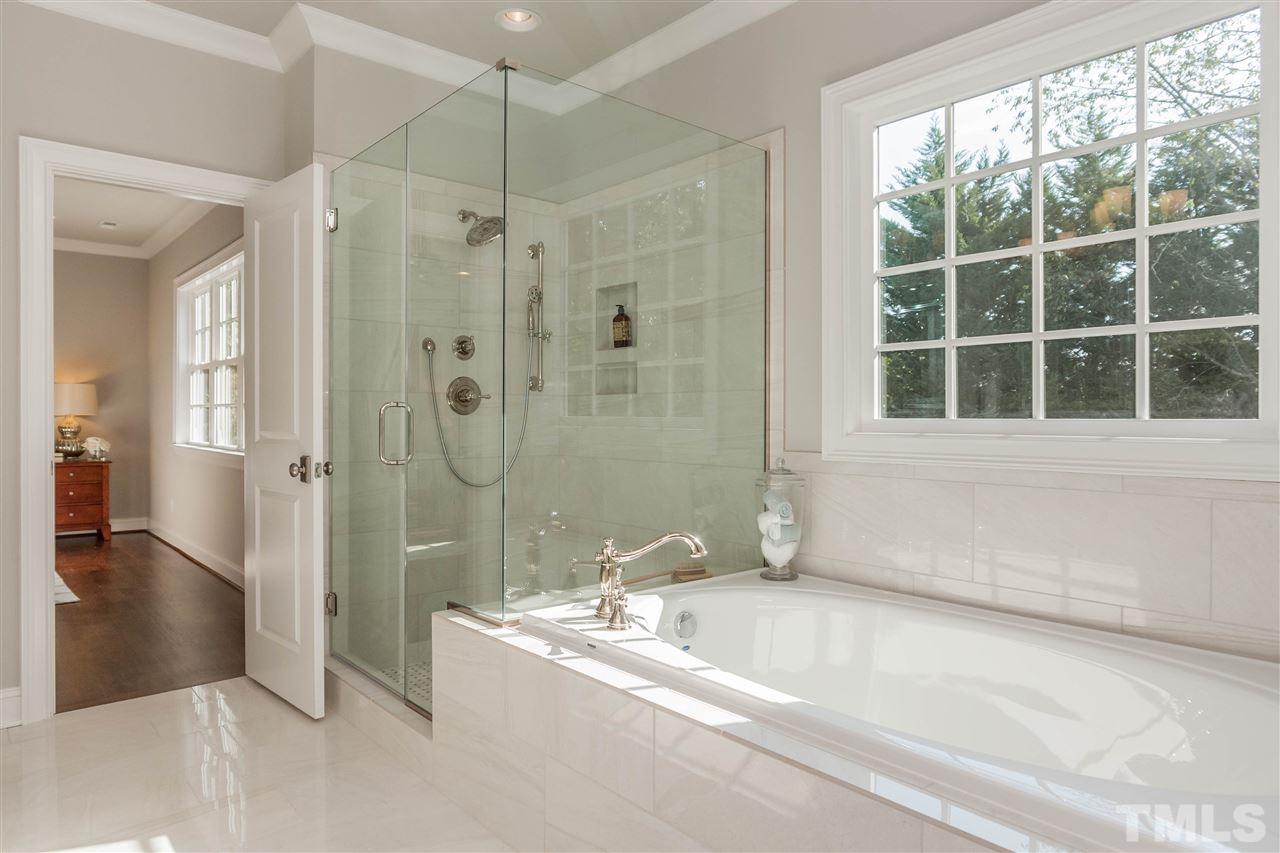 3106 Ashel Street Raleigh, NC 27612 - Photo 18 of 25 a bathroom with a bathtub and a shower