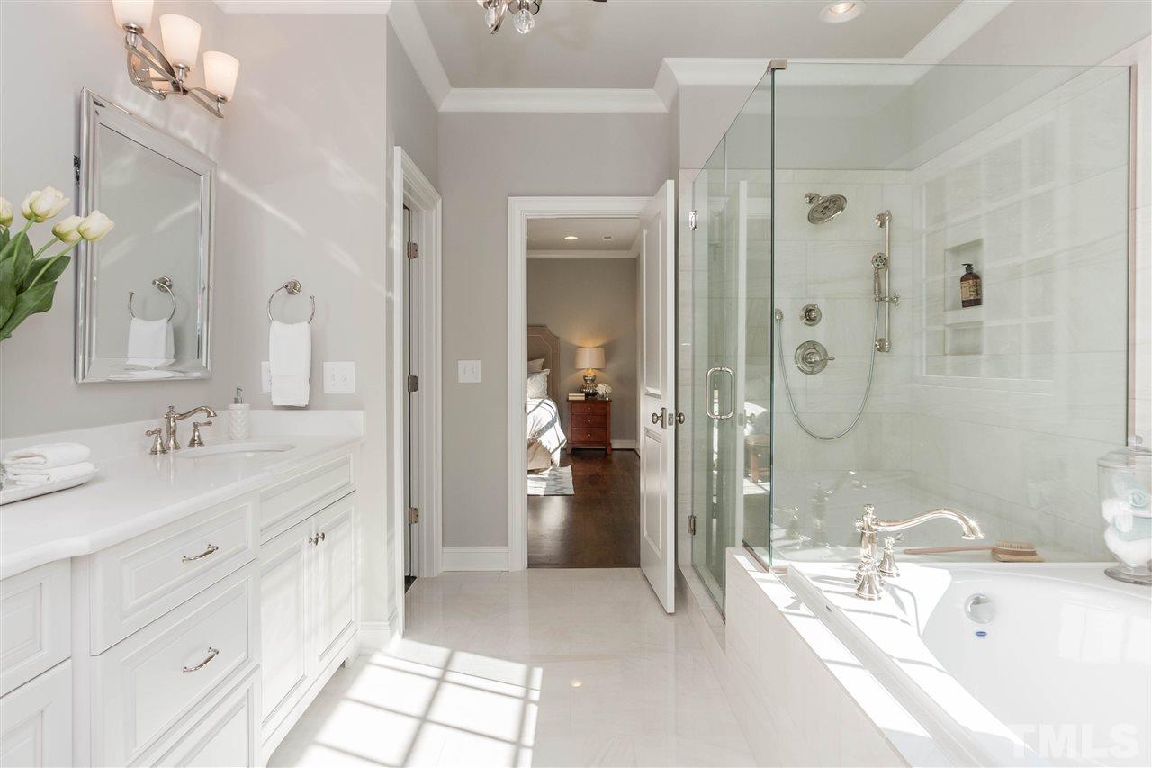 3106 Ashel Street Raleigh, NC 27612 - Photo 19 of 25 a bathroom with a double vanity sink mirror and shower