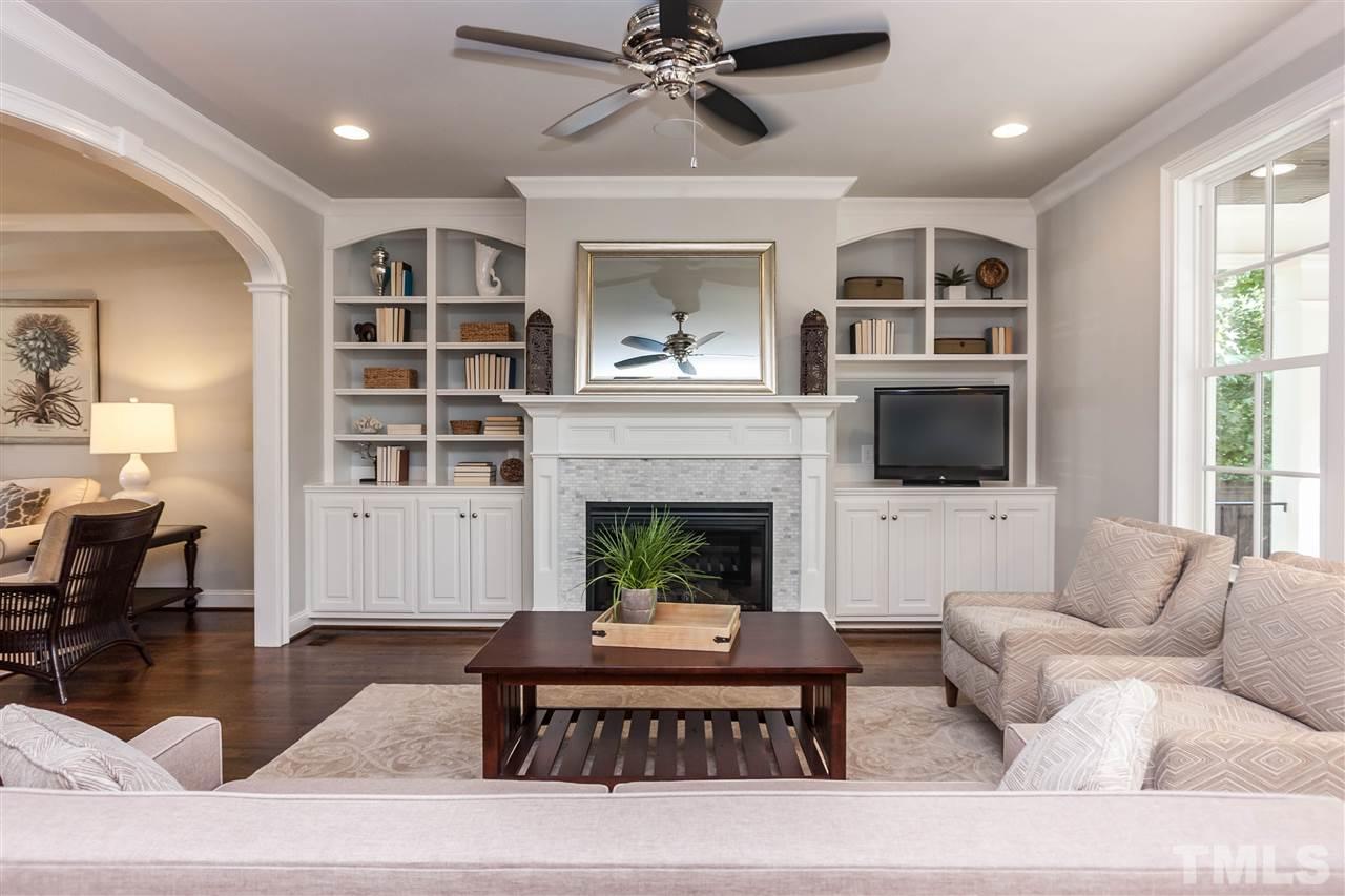 3106 Ashel Street Raleigh, NC 27612 - Photo 6 of 25 a living room with furniture and a fireplace