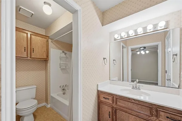 a bathroom with a sink a mirror and a shower