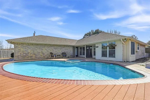 a view of pool with umbrella