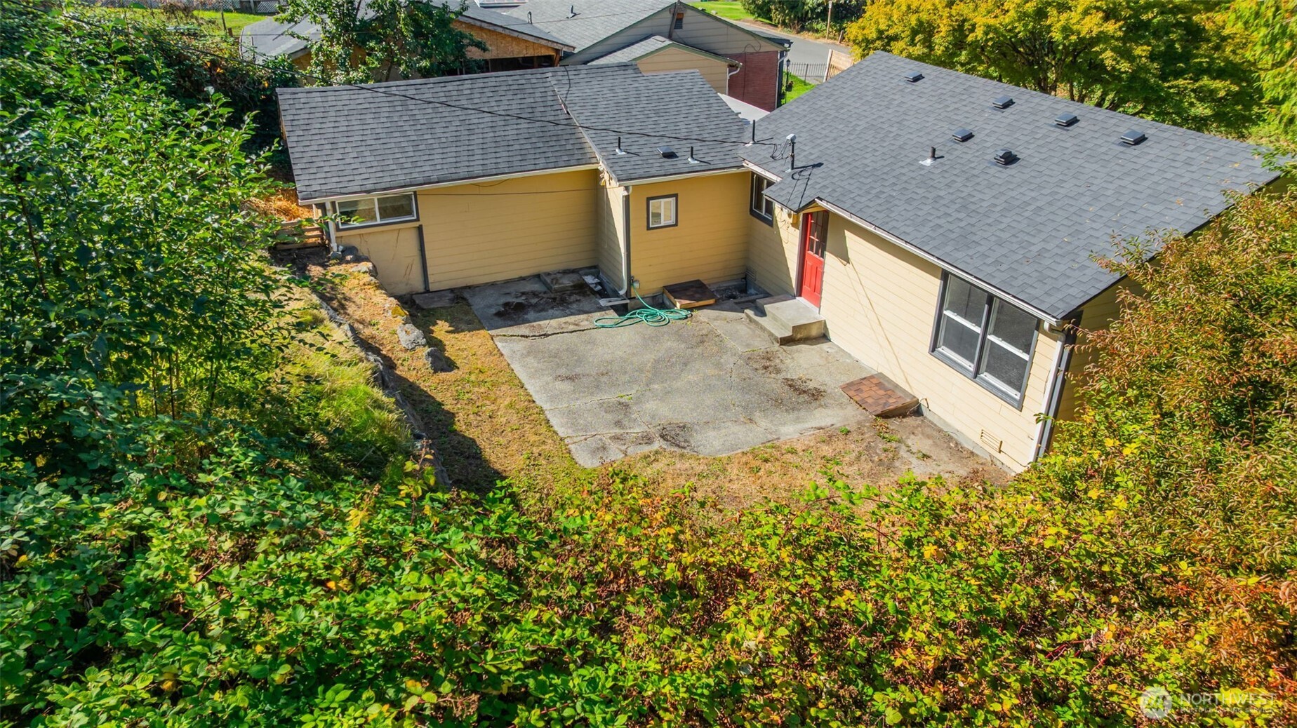 7051 South 125th Street Seattle, WA 98178 - Photo 21 of 32 an aerial view of residential houses with outdoor space and trees