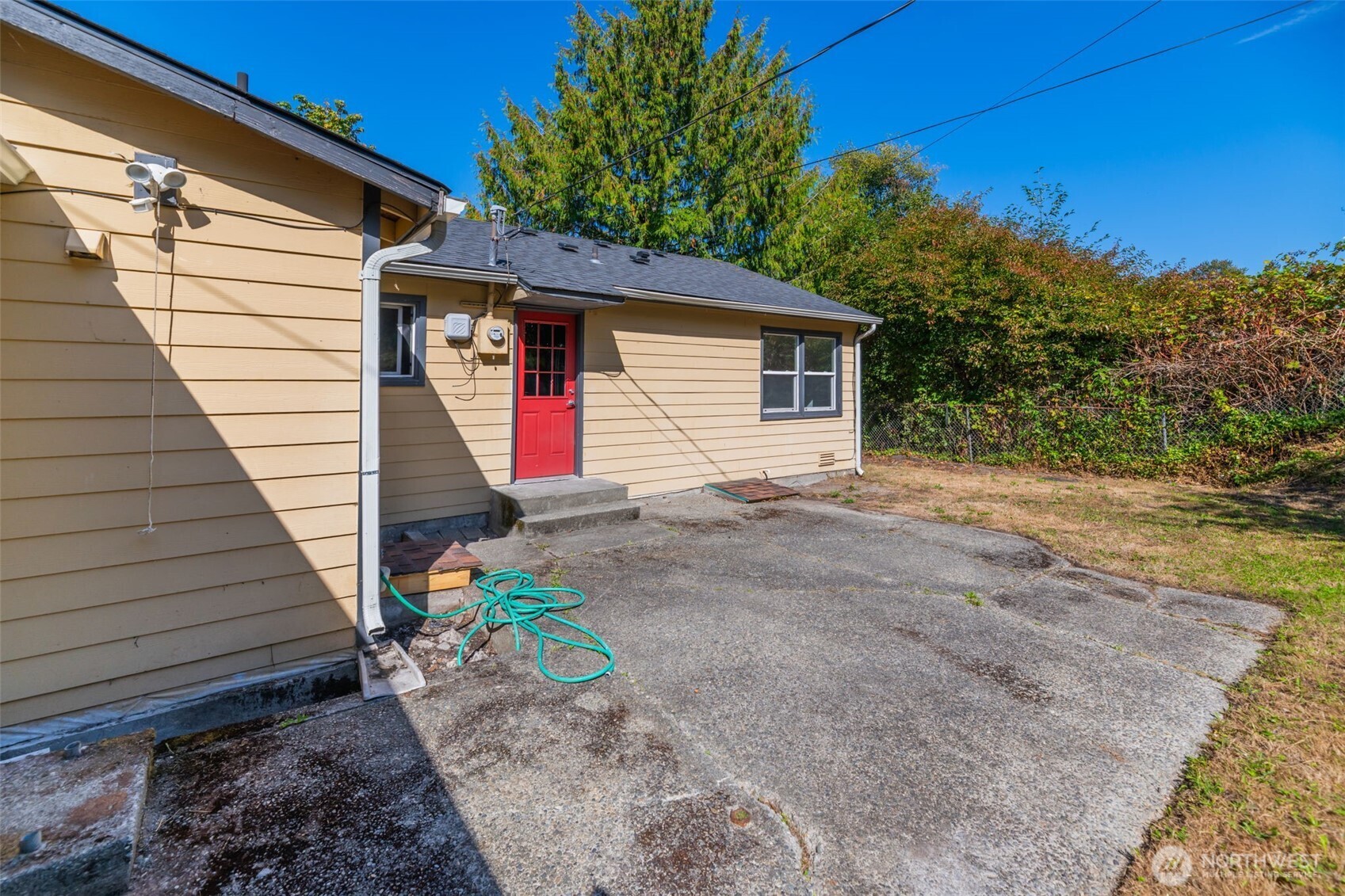 7051 South 125th Street Seattle, WA 98178 - Photo 24 of 32 a view of a house with a yard