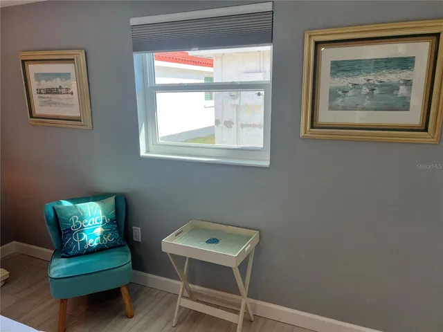 a bathroom with a toilet sink and a mirror