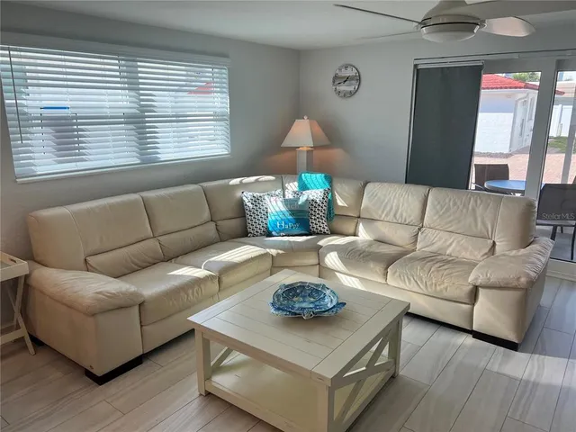 a living room with furniture and a window