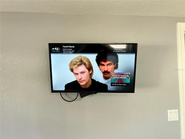a bathroom with a granite countertop toilet sink and mirror