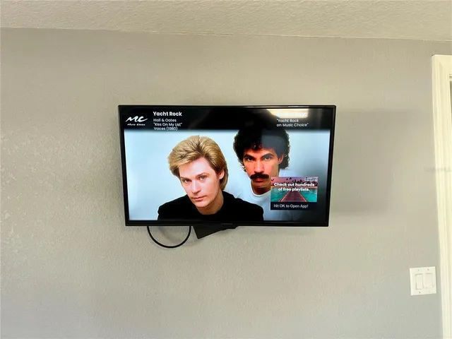 a bathroom with a granite countertop toilet sink and mirror