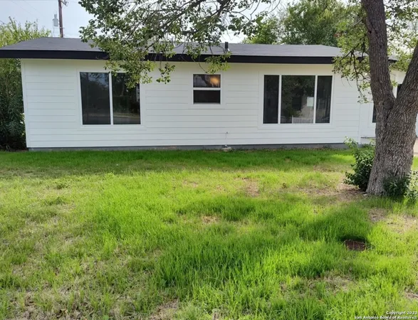 a view of house with yard
