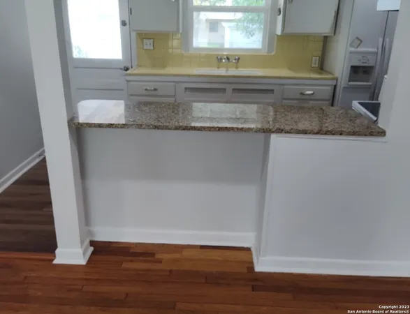 a view of a sink and a mirror