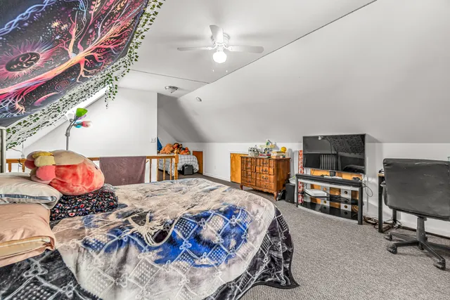 a bedroom with a bed and a tv in it