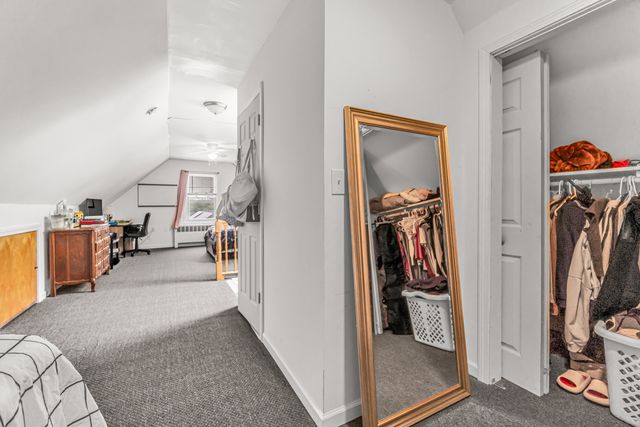 a view of a livingroom with storage and utility room