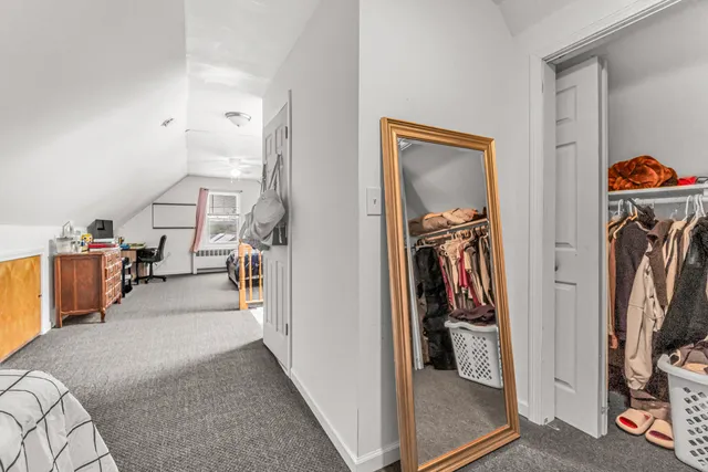 a view of a livingroom with storage and utility room