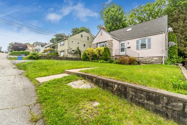 a front view of a house with a yard