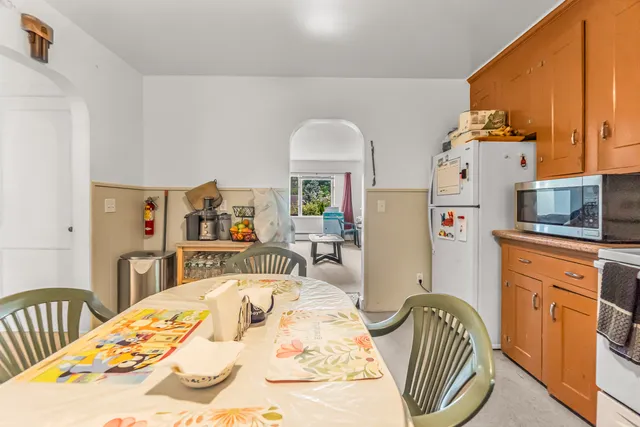 a bed room with a bed and a dresser