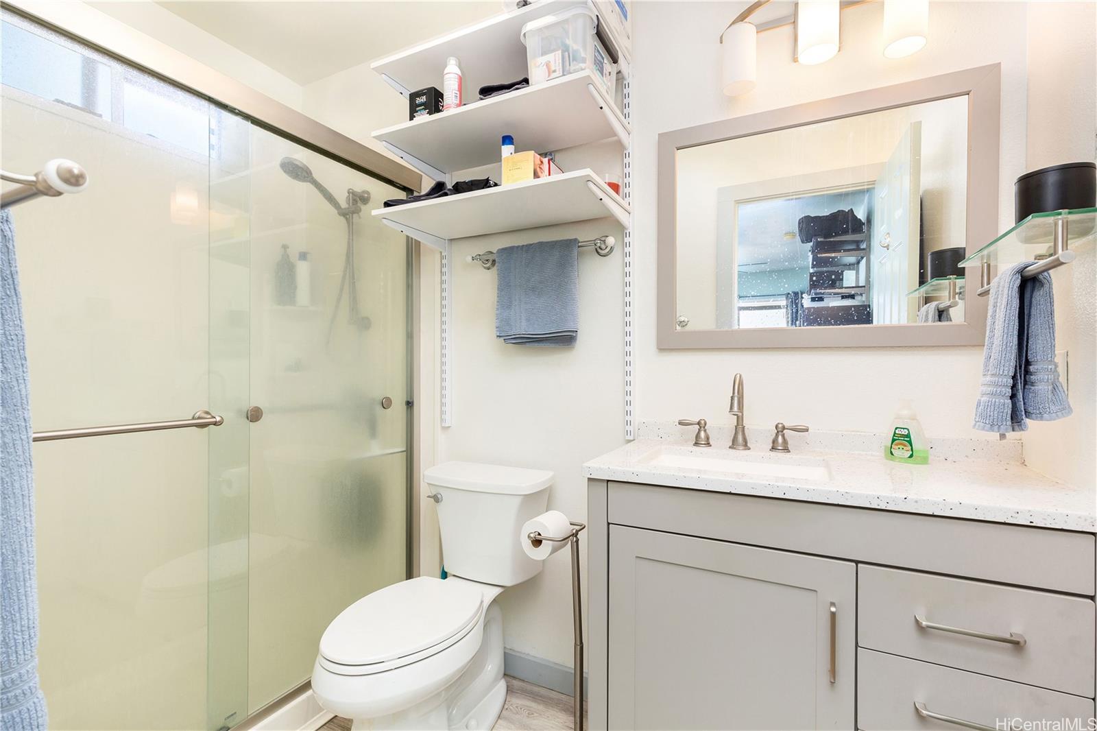 1508 Frear Street, Unit B Honolulu, HI 96813 - Photo 9 of 15 a bathroom with a granite countertop sink mirror vanity and toilet