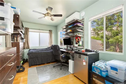 a bedroom with furniture and a window