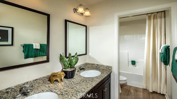 14073 Versimo Lane Beaumont, CA 92223 - Photo 16 of 20 a bath room with sink and a mirror