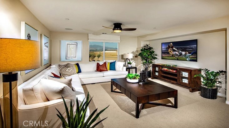 14073 Versimo Lane Beaumont, CA 92223 - Photo 5 of 20 a living room with furniture and a flat screen tv