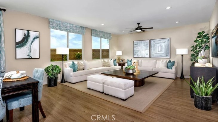 14073 Versimo Lane Beaumont, CA 92223 - Photo 8 of 20 a living room with furniture and a large window