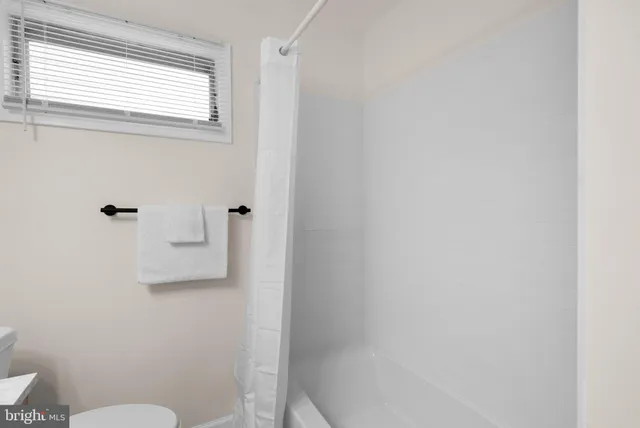 a bathroom with a sink a toilet