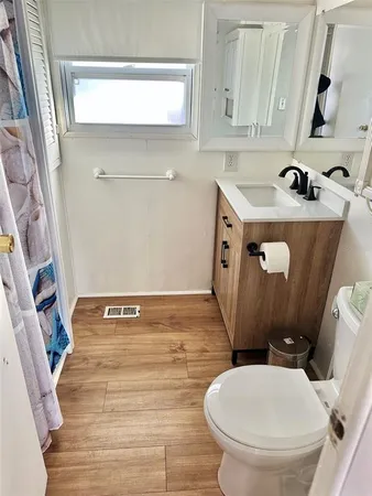 a bathroom with a toilet and a sink
