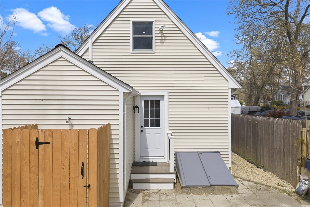 8 Cottage Street Wareham, MA 02571 - Photo 25 of 30 a view of a white house with wooden fence