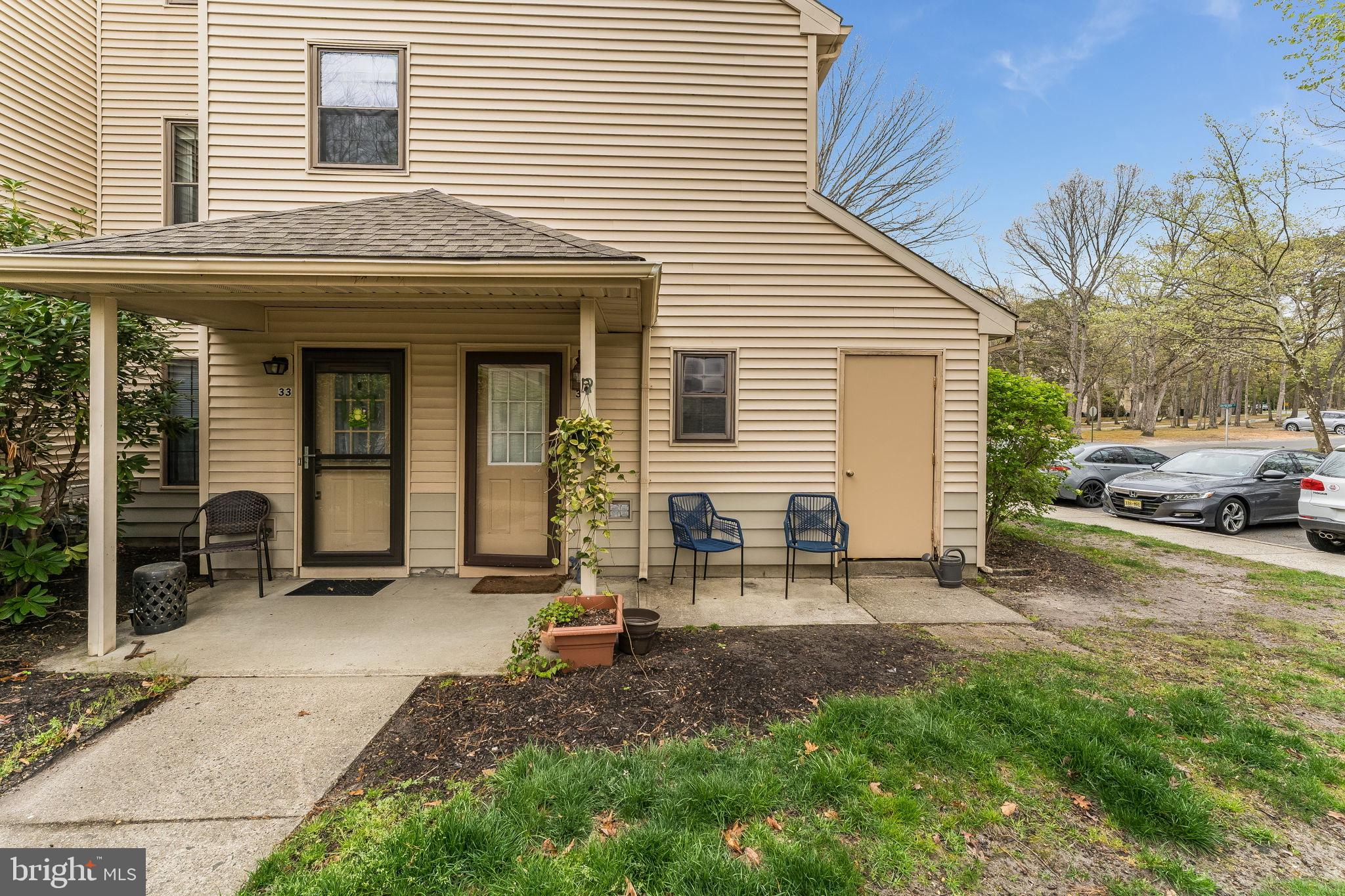 32 Azalea Circle Jackson, NJ 08527 - Photo 2 of 31 Charming entryway with lush greenery.