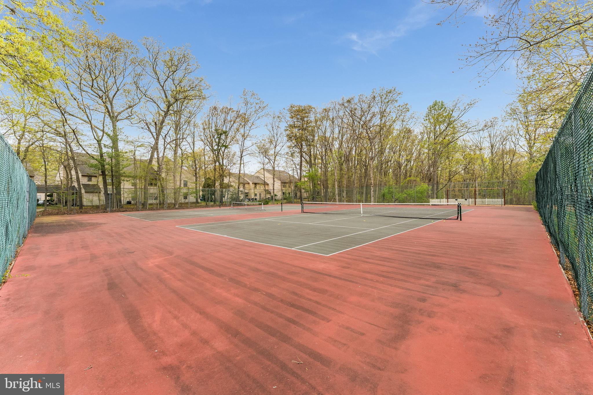 32 Azalea Circle Jackson, NJ 08527 - Photo 25 of 31 Serene tennis court in nature's embrace.