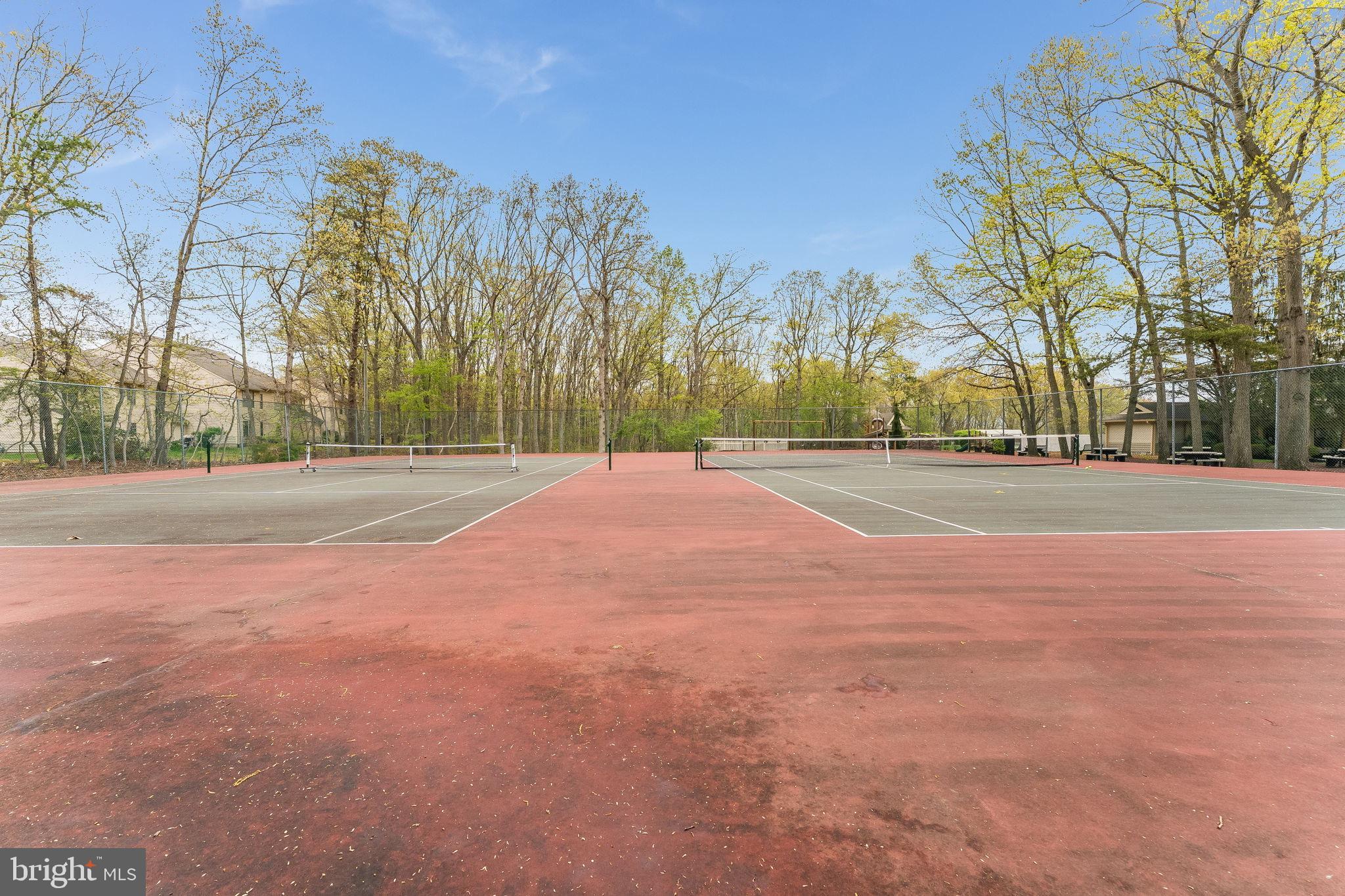 32 Azalea Circle Jackson, NJ 08527 - Photo 26 of 31 Serene tennis courts in nature's embrace.